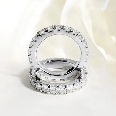 Stunning Moissanite Eternity Ring showcasing brilliant round-cut stones, perfect for women's fine jewelry collections.