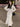 Elegant Ellie Skirt Suit in white with trumpet silhouette and turn-down collar, perfect for business and formal occasions.