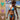 Model wearing the 13 Color Crochet Micro Bikini Sunbathing, perfect for beach days with vibrant knit patterns.