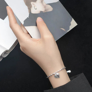 Elegant Silver Heart Bracelet on a wrist, perfect for women, showcasing fine craftsmanship and 925 sterling silver.